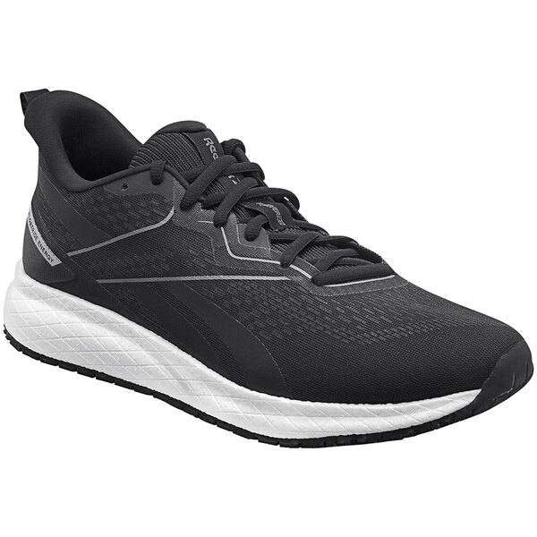 A black and white Reebok athletic shoe with a white sole.