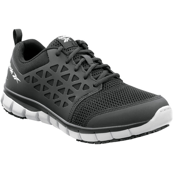 A black Reebok athletic shoe with a white sole and gray accents.