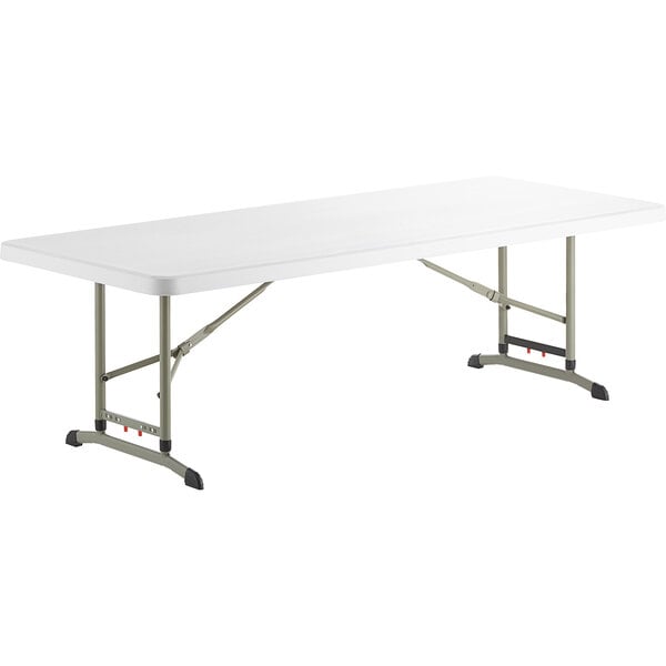 A white rectangular table with metal legs.