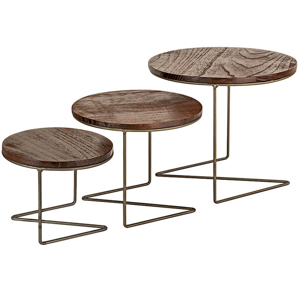 A group of Kalalou round wooden display stands with metal legs.