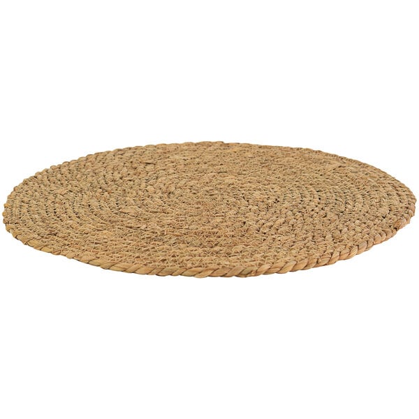 A round woven seagrass placemat.