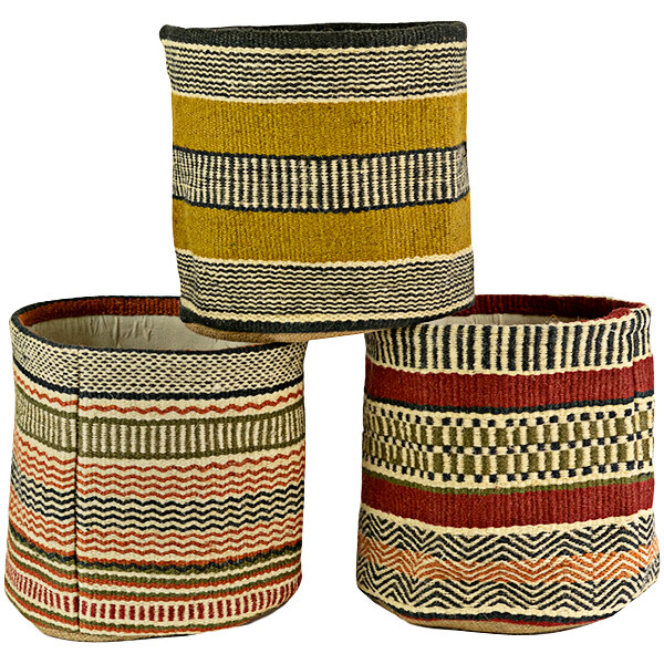 A group of Kalalou woven jute display baskets with different patterns and colors.