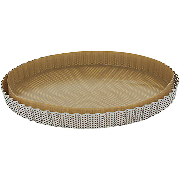 A round brown tart mold with a metal rim.