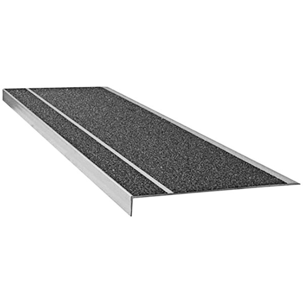 A Wooster Flexmaster Stair Tread with black grit surface on metal.