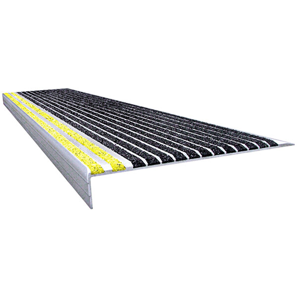 A black Wooster Stairmaster stair tread with yellow and black striped grit surface.