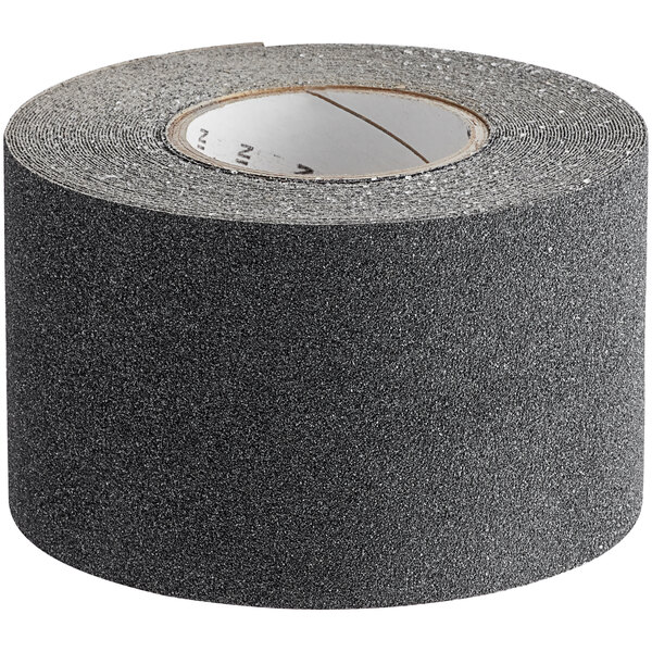 A roll of black tape with a white label and black text.