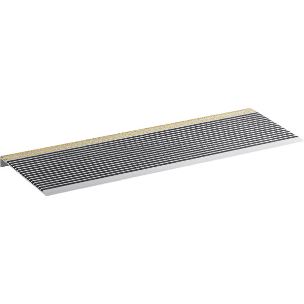 A metal shelf with a yellow and black striped mat.