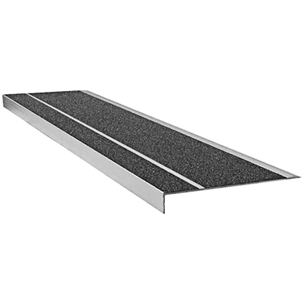 A black rectangular Wooster Flexmaster stair tread with black and white grit surface strips.