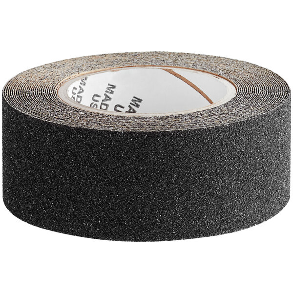 A roll of black Wooster Flex-Tred anti-slip tape with black text.