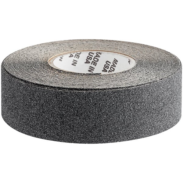 A roll of black anti-slip tape with a grey stripe on it.