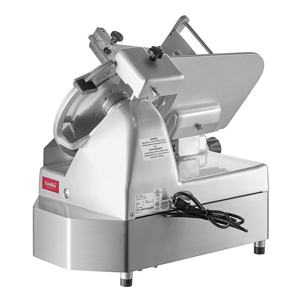 A white Estella heavy-duty commercial meat slicer with a circular metal blade.