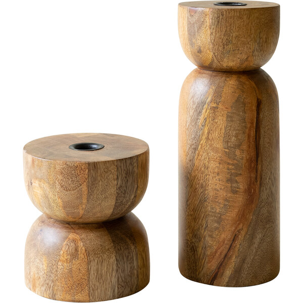 A pair of wooden taper candle holders on a wooden base.