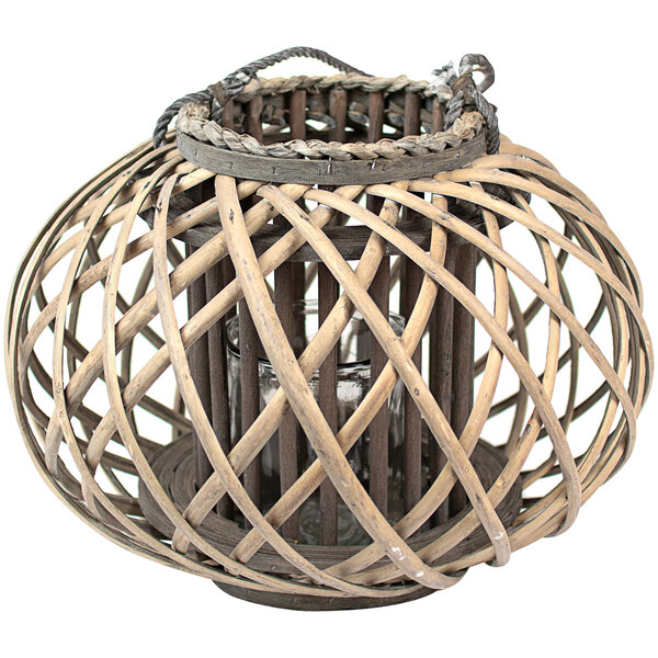A gray wicker lantern with a glass candle holder inside.