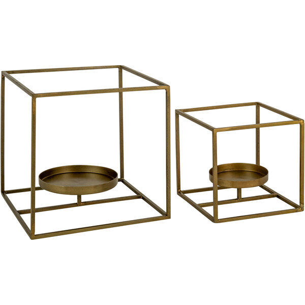 A pair of metal square candle holders with a candle inside.