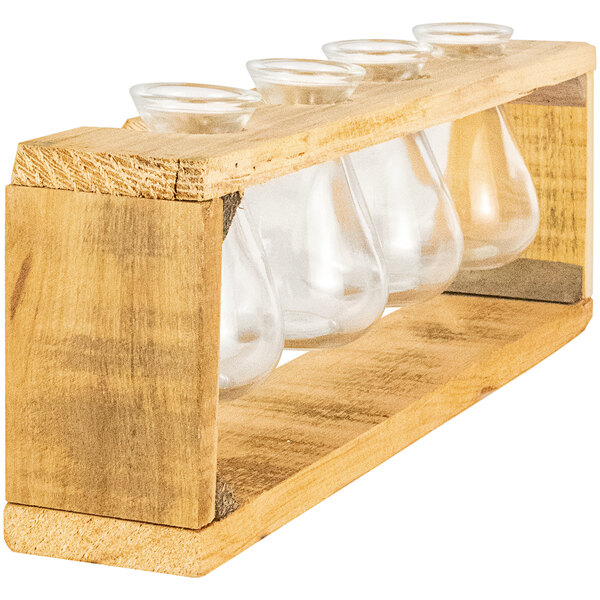 A wooden stand with three clear glass bud vases.