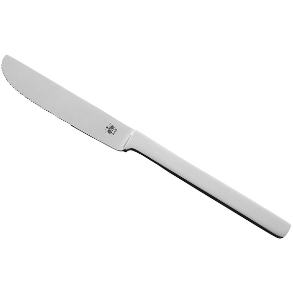 A silver RAK Porcelain dinner knife with a white handle.