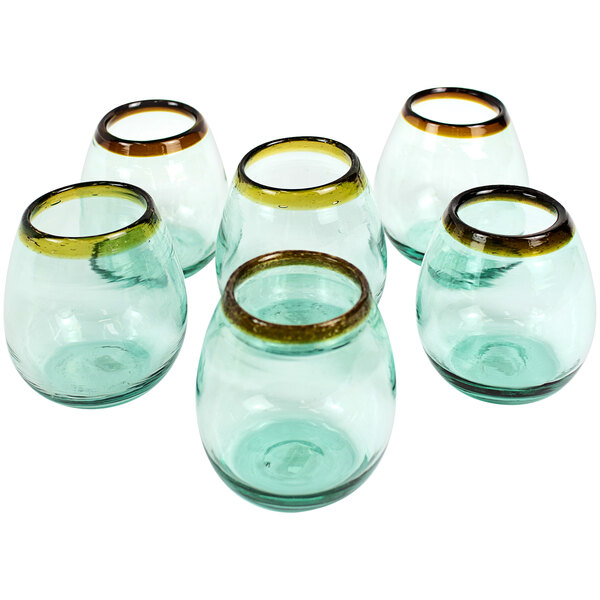 Six green glass wine glasses with amber rims.