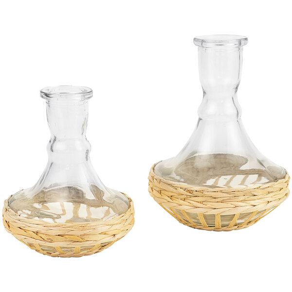 Two clear glass bud vases with woven seagrass accents.