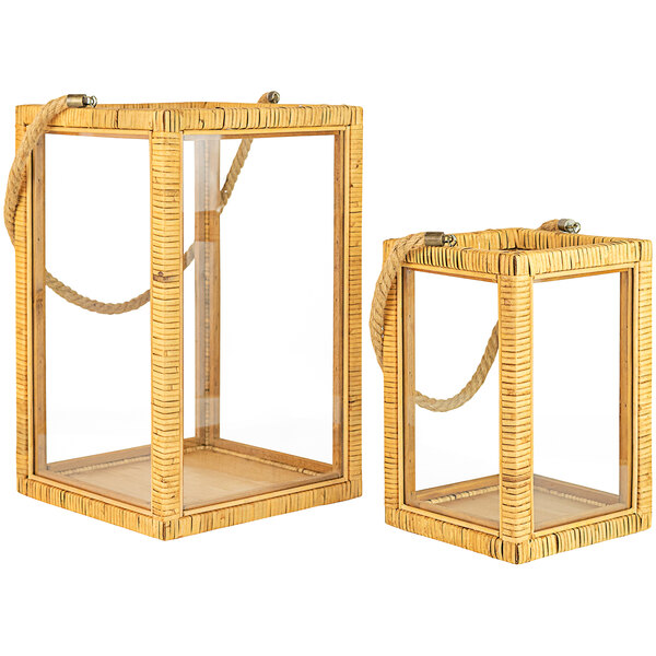 A rectangular wicker lantern with glass windows and handles.