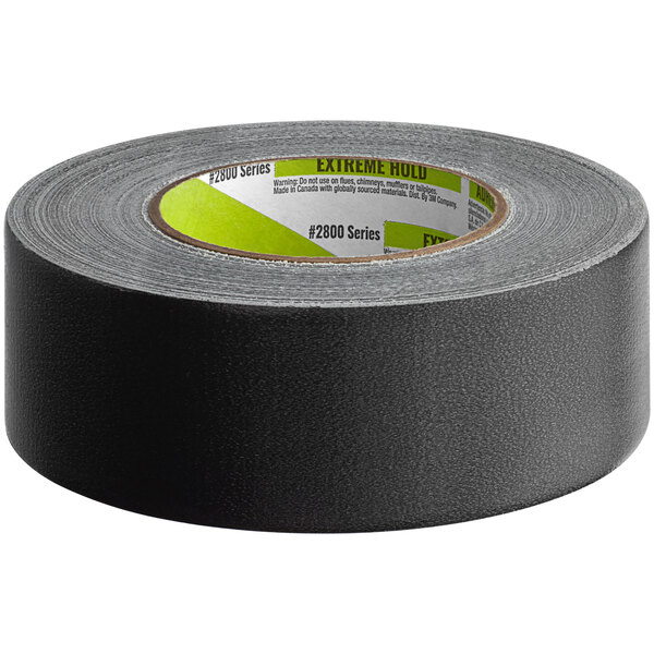 A roll of black 3M Extreme Hold Duct Tape with green writing on it.