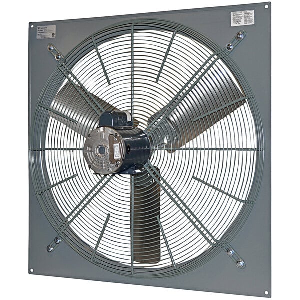A Canarm panel-mounted industrial exhaust fan with a round metal blade.