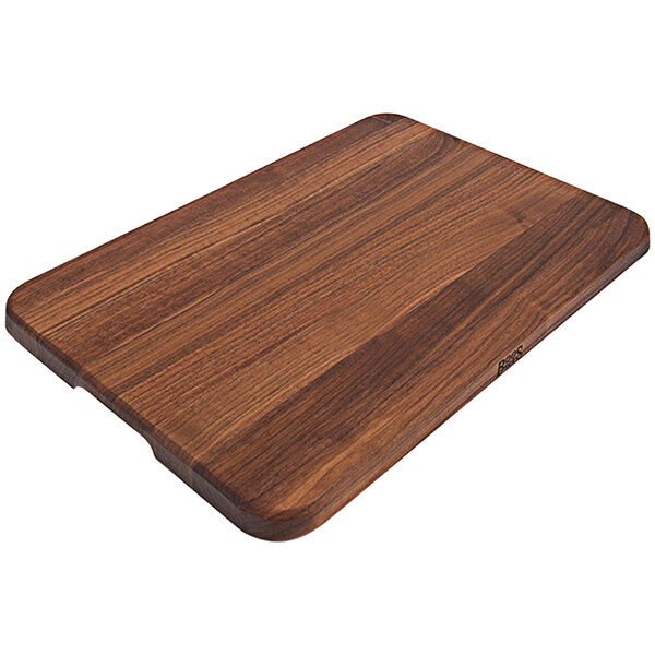 A John Boos walnut wood cutting board with finger grips.