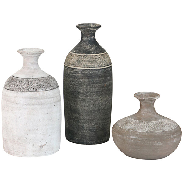 A group of three Kalalou clay vases with different colors and designs.