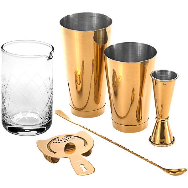 A Barfly gold plated cocktail mixing kit on a counter.