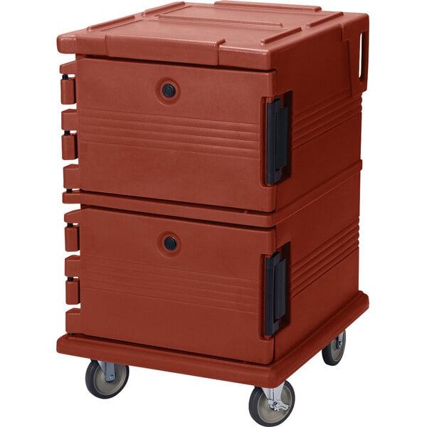 A close-up of a red plastic container on wheels with the words "Cambro Ultra Camcarts" on it.
