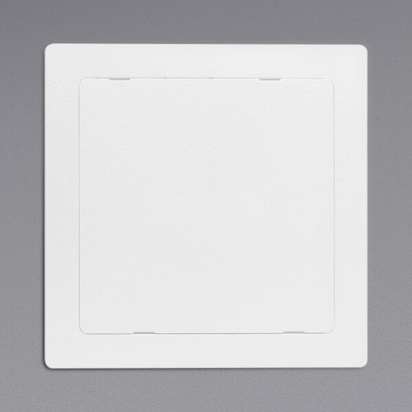 A white square Oatey plastic access panel on a gray background.