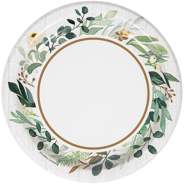 A white paper plate with a white border with green leaves on it.