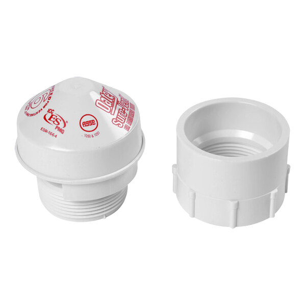 A white plastic Oatey cap with red writing on it.