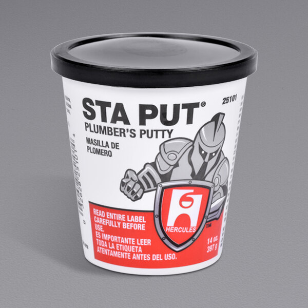 A white container of Hercules Sta Put Plumber's Putty with a black lid.