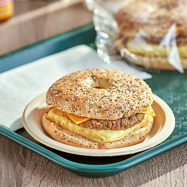 A Timber Ridge Farms bagel thin sandwich with egg and cheese on a plate.