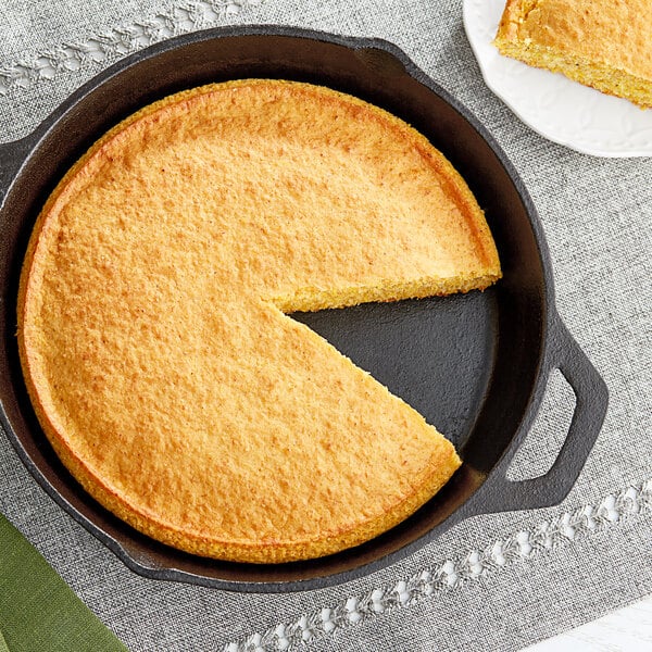 A pan with a piece of Bob's Red Mill cornbread in it.