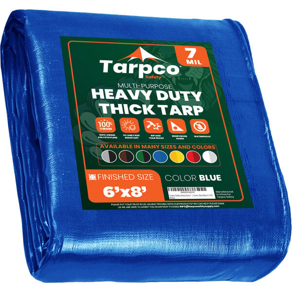 A blue Tarpco heavy-duty weatherproof tarp with reinforced edges and a green label.