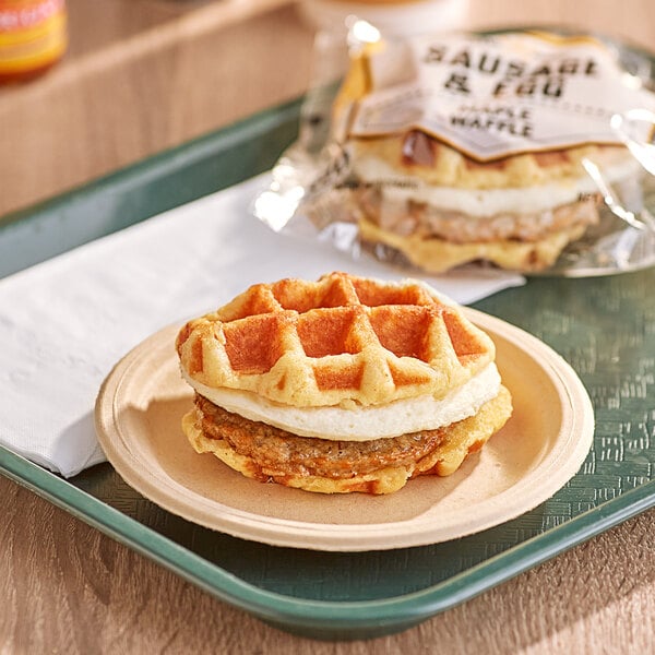 A Grand Prairie sausage and egg waffle sandwich on a plate.