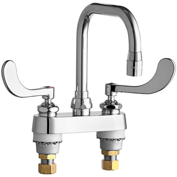 A chrome Chicago Faucets deck-mounted faucet with two wristblade handles.