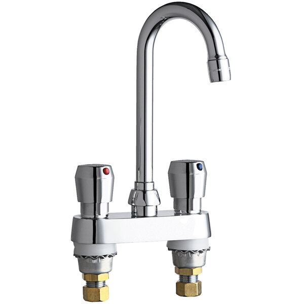 A chrome Chicago Faucets metering faucet with two handles and a gooseneck spout.