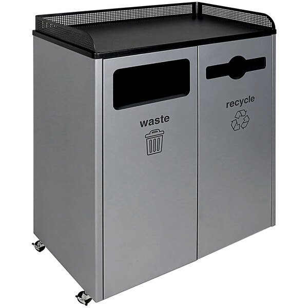 A grey powder-coated steel Busch Systems decorative recycle/waste receptacle with black tops for two compartments.