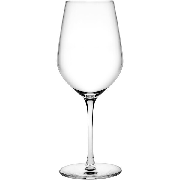 A close-up of a clear Nude Climats wine glass with a long stem.