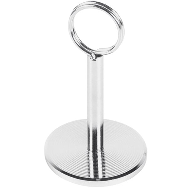 A silver metal Elite Global Solutions ring holder with a circle on a weighted base.
