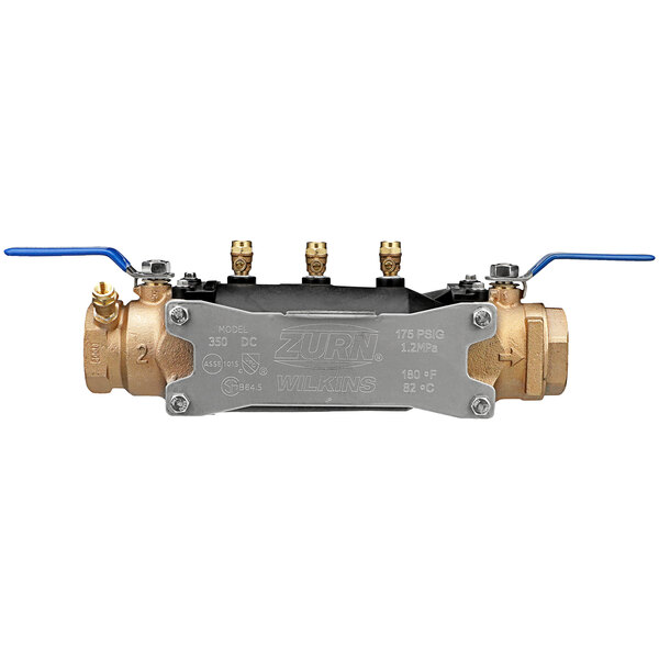 A Zurn 2-350 double check valve backflow preventer with brass handles.