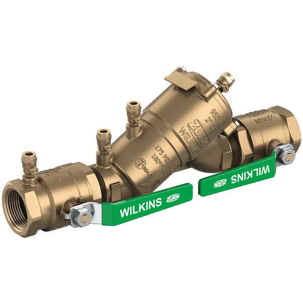 A Zurn brass double check valve with green labels and green handles.