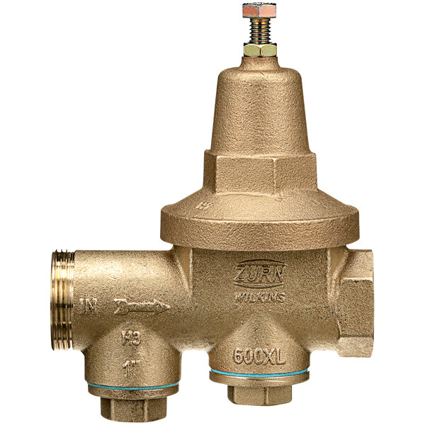 A close-up of a Zurn brass water pressure reducing valve with a brass union connection.