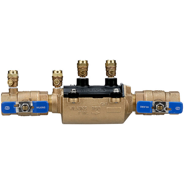 A close-up of a Zurn 1" Double Check Valve Backflow Preventer with two blue handles.