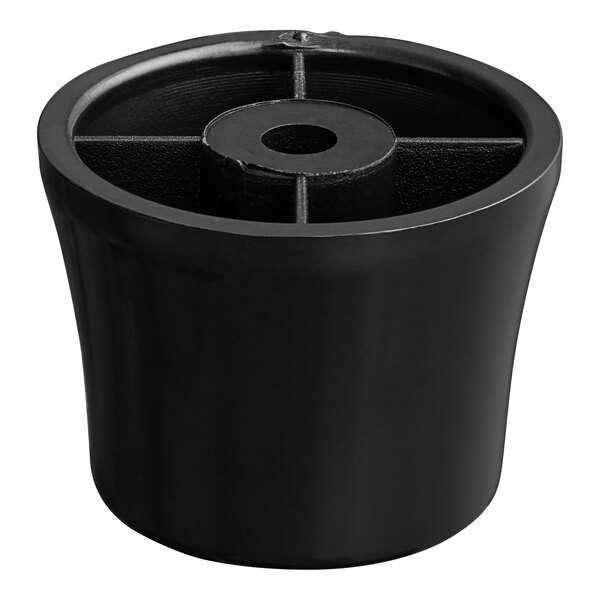 A black plastic foot with holes in the bottom.