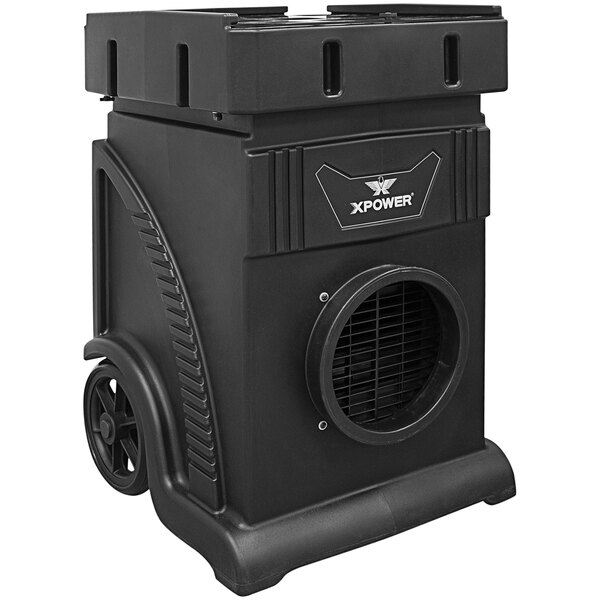 A black rectangular XPOWER air scrubber with wheels and a vent.
