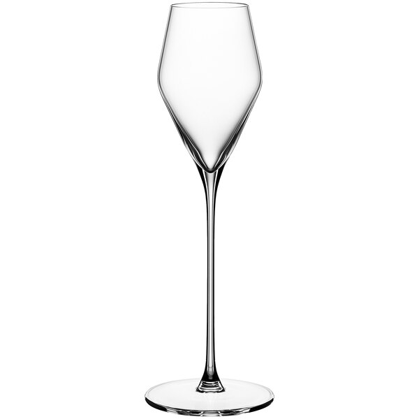 A close-up of a clear Spiegelau dessert wine glass with a long stem.