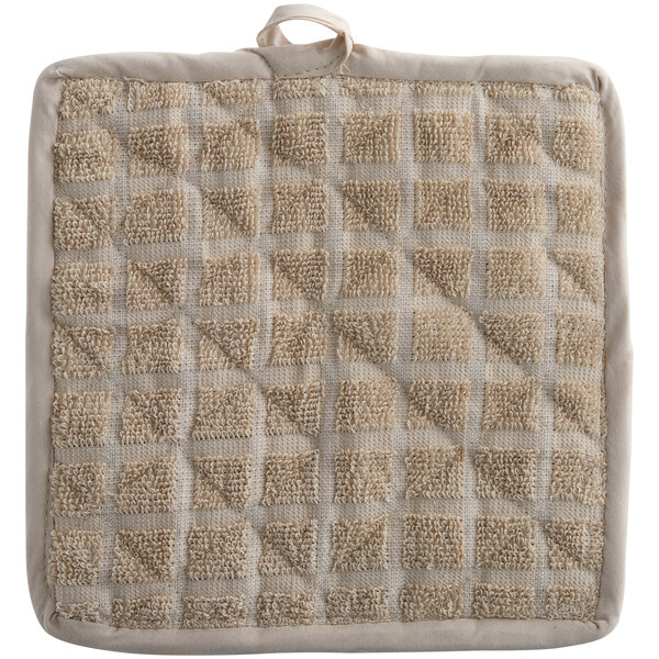 A white pot holder with a tan windowpane pattern.
